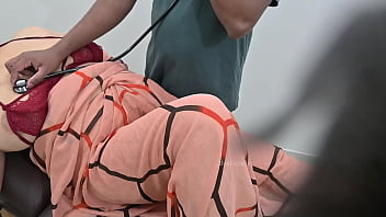 Physician Examining A Female Patient At A Medical Facility